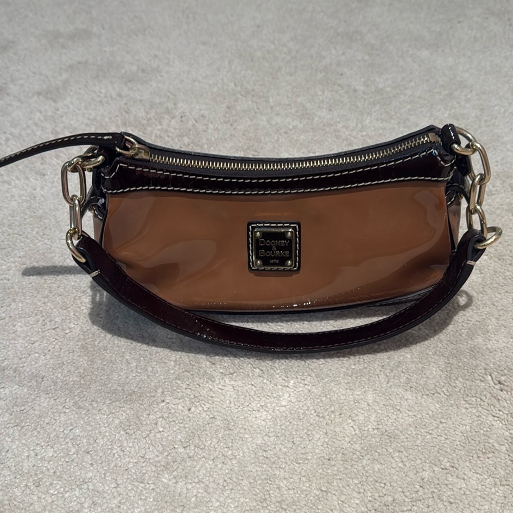 Dooney and Bourke mini handbag in tan patent leather